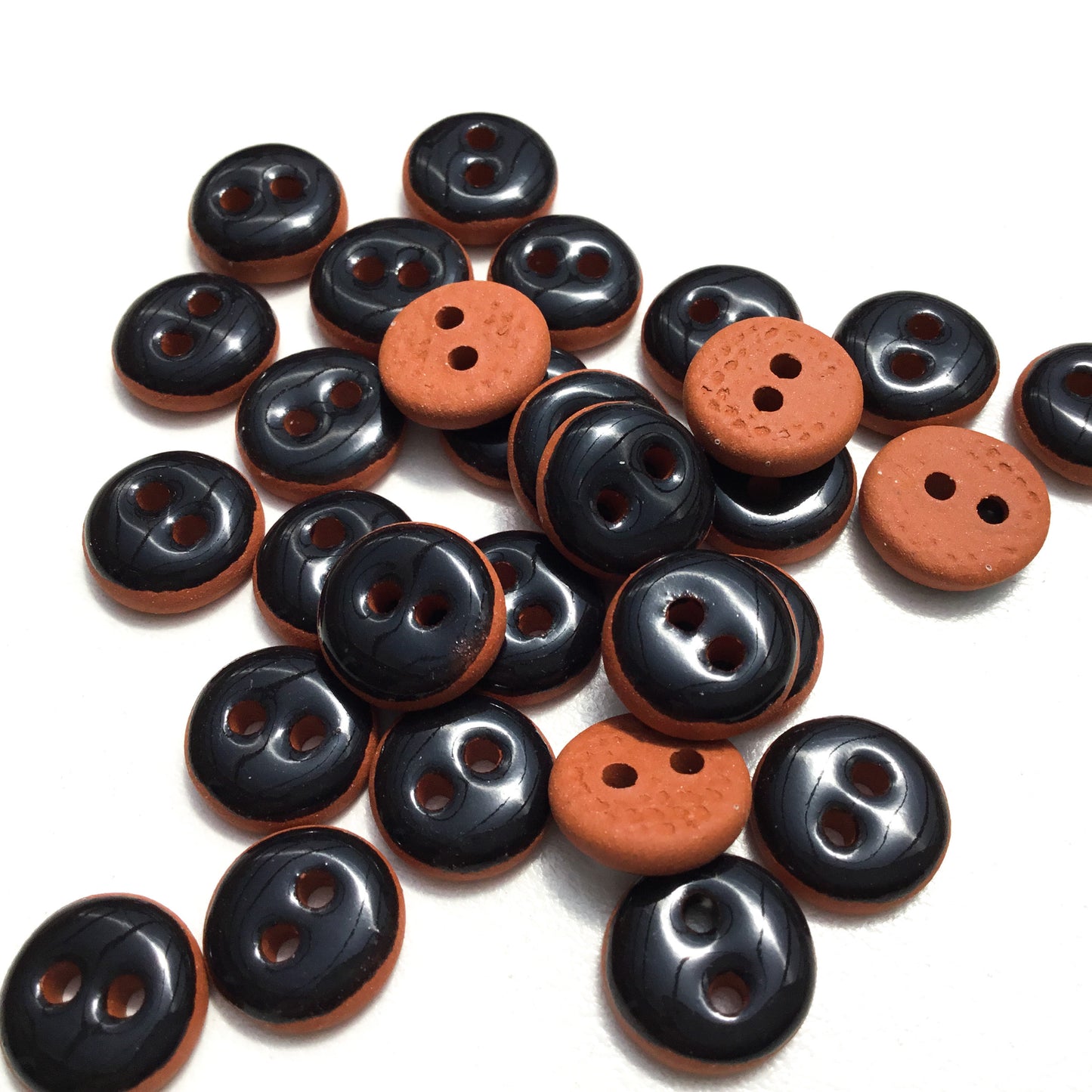 Black Ceramic Buttons on Red Clay - 7/16"