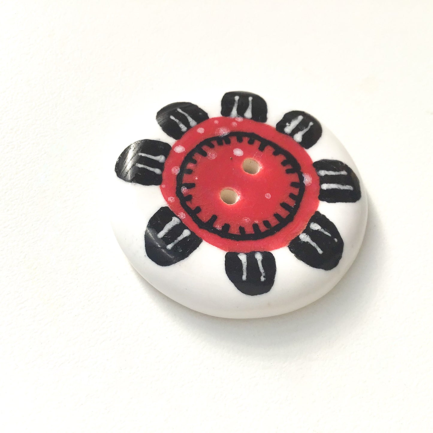 Playful Flower Button -Red & Black on White Background - 1 1/2"